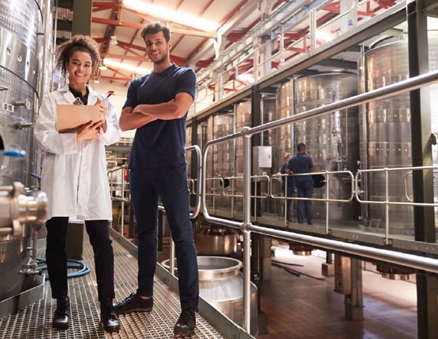 People enjoying event with plates of delicious local food